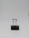 Black paperclip made of iron and very shiny. Suitable for people who are looking for pictures about paper clips and the like for