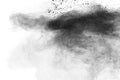 Black particles splatter on white background. Black powder dust burst Royalty Free Stock Photo