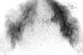 Black particles splatter on white background. Black powder dust burst