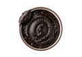 Black paste swirl in container isolated on transparent background Royalty Free Stock Photo