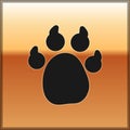 Black Paw print icon isolated on gold background. Dog or cat paw print. Animal track. Vector Royalty Free Stock Photo