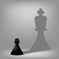 Black Pawn with King Shadow Royalty Free Stock Photo
