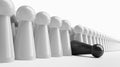 Black pawn in a row of white figures Royalty Free Stock Photo