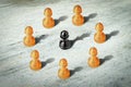 Black pawn surrounded by white ones. Leadership concept. Innovative solutions. Strategies. New ideas. Business. Royalty Free Stock Photo