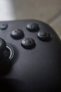 Black PC Gamepad Controller Lying on Desk Minimalist Gaming Setup Royalty Free Stock Photo