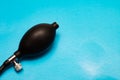 Black pear tonometer closeup on blue background