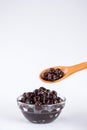 Black pearls. Boiled tapioca pearls for bubble tea on white background. Royalty Free Stock Photo