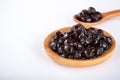 Black pearls. Boiled tapioca pearls for bubble tea on white background. Copy space Royalty Free Stock Photo