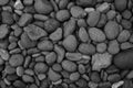 Black pebble stone, Shiny black lava pebbles on the beach, Black lava pebble stone Royalty Free Stock Photo