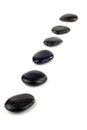 Black pebbles in a row Royalty Free Stock Photo