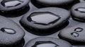 Black pebbles with water droplets on them. Royalty Free Stock Photo