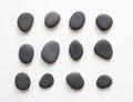 Black pebbles on white background Royalty Free Stock Photo