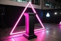 Black pedestal with neon pink light in triangular frame Royalty Free Stock Photo