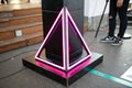 Black pedestal with neon pink light in triangular frame Royalty Free Stock Photo