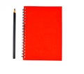 Black pen beside a red color covered single note paper diary isolated on a white background Royalty Free Stock Photo