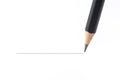 Black pencil drawing a straight line, isolated on white background Royalty Free Stock Photo