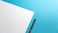 Pencil Lies On A Paper Sheet On Blue Background With Copy-Space. Office Space Creativity Minimalism Concept