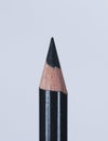 Black pencil point on a white background