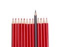 Black pencil standing out from the red pencils, isolated Royalty Free Stock Photo