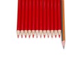 Black pencil standing out from the red pencils, isolated Royalty Free Stock Photo