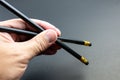 Black pencils holding in a hand Royalty Free Stock Photo