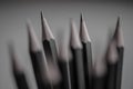 Black pencils tip closeup with more blurred in the backround Royalty Free Stock Photo
