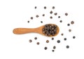 Black pepper or black peppercorns seeds in wooden spoon isolated on white background Royalty Free Stock Photo