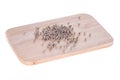 Black Pepper on chopping board white background Royalty Free Stock Photo