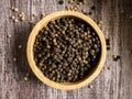 The black pepper corn on wood table for food concept Royalty Free Stock Photo