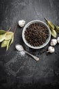 Black pepper corns, garlic, salt and laurel Royalty Free Stock Photo