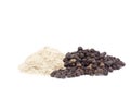 Black pepper corns scattered on white background and Black pepper Powder Royalty Free Stock Photo