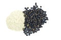 Black pepper corns scattered on white background and Black pepper Powder Royalty Free Stock Photo