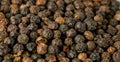 Black pepper grains as background close up Royalty Free Stock Photo
