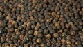 Black pepper grains as background close up Royalty Free Stock Photo