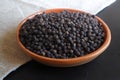 Black pepper peas in a bowl. Close up. Royalty Free Stock Photo