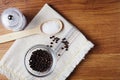 black pepper peas in a glass bowl on a linen napkin, salt mill on a wooden kitchen table Royalty Free Stock Photo