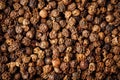 Black pepper peppercorns background