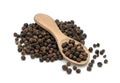 Black pepper or black peppercorns seeds in wooden spoon isolated on white background Royalty Free Stock Photo
