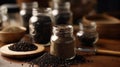 Black Pepper Powder in Glass Jar and Bowl on Kitchen Table Blurred Background Royalty Free Stock Photo