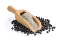 Black pepper powder in wood scoop on white background Royalty Free Stock Photo