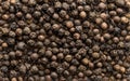 Black pepper seeds as background texture. Organic food Royalty Free Stock Photo