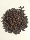 Black pepper seeds pile from top on white background Royalty Free Stock Photo