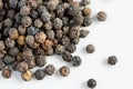 Black pepper seeds on a white background Royalty Free Stock Photo