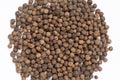 Black peppercorns close-up top view on white background. Royalty Free Stock Photo