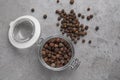 Black peppercorns in jar on grey table Royalty Free Stock Photo