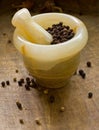 Black peppercorns, mortar and pestle Royalty Free Stock Photo