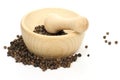 Black peppercorns with mortar Royalty Free Stock Photo