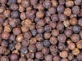 Dried black pepper seeds as a background. Top view of peppercorn Royalty Free Stock Photo