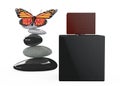 Black Perfume Spray Bottle with Butterfly over Balanced stones Royalty Free Stock Photo