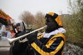 Black Pete, the helper of dutch traditional celebration of Sinterklaas making music.